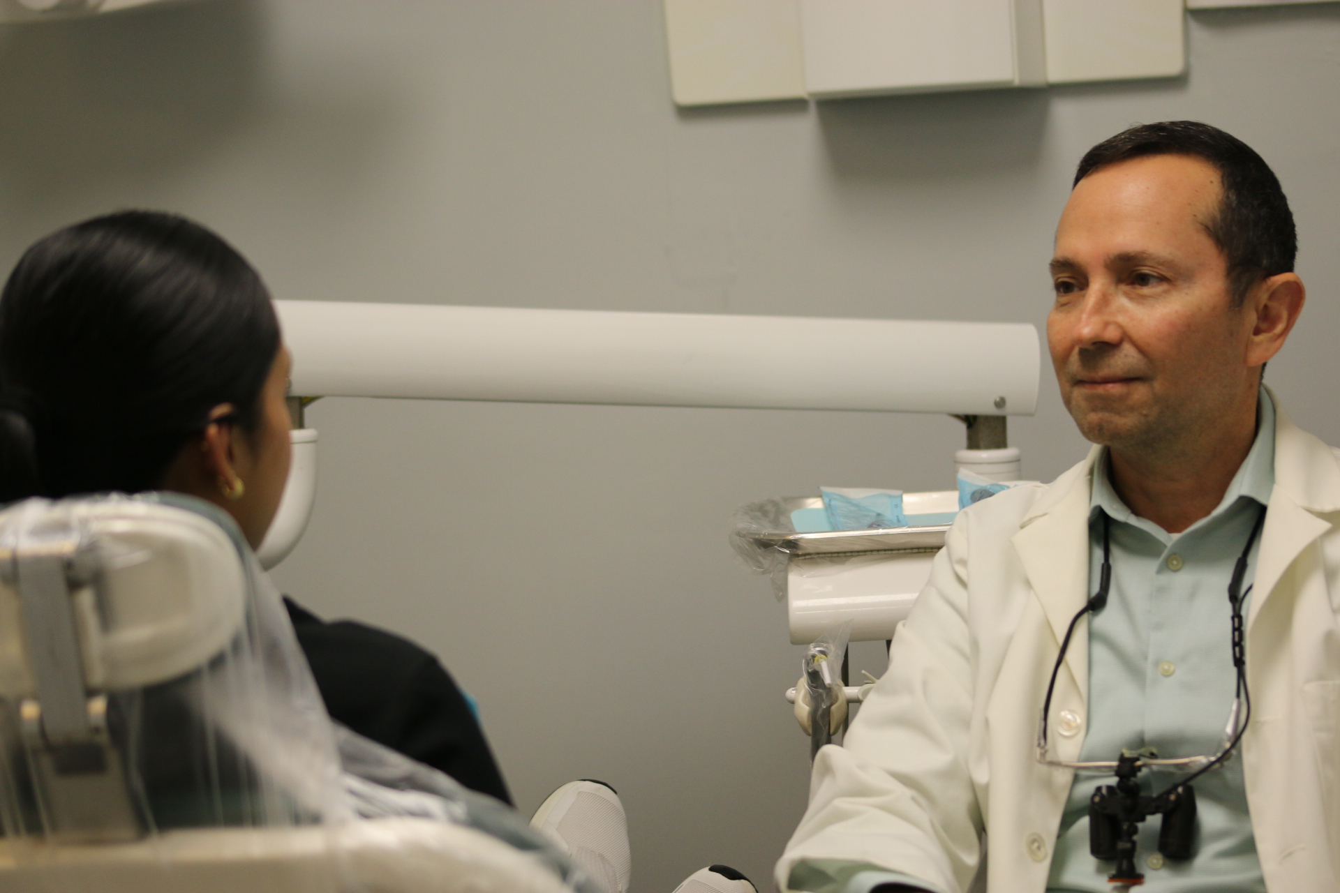 Dr. Victor Dongo listening to a patient during a consultation